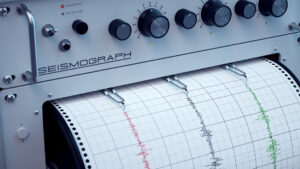 Seismograph zeigt Erdbeben auf Papierrolle an.